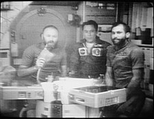 Grayscale television picture of the three members of Skylab 4