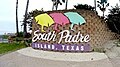 South Padre Island entrance sign with roundabout for photos.
