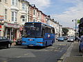 Southern Vectis 235 Luccombe Bay (XDL 872), a MAN 11.190/Caetano Algarve, in the High Street, Sandown, Isle of Wight. It was out of service at the time, having just finished operating route 24 to Yaverland, and now moving to Shanklin ton start on route 23. Both routes were in their last day of operation with Wightbus, however, Wightbus vehicles had transferred to Southern Vectis early to allow them to rebrand them for the new timetable. As a result, some coaches from Southern Vectis were running on Wightbus routes during their last few weeks.