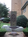 Khachkar (cross stone) in the church yard, dedicated to the victims of the Armenian genocide