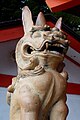 Komainu flanking a subsidiary shrine at the Ikuta Shrine.