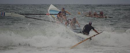 Surf boat passing a breaker. SurfBoatGoingTroughBreak.jpg