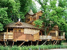 Treehouse at Alnwick Gardens in the United Kingdom, with walkways through the tree canopy The Treehouse - geograph.org.uk - 32426.jpg