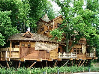 Treehouse at The Alnwick Gardens in the United Kingdom, with walkways through the tree canopy The Treehouse - geograph.org.uk - 32426.jpg