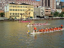 Dragon boat racing on the Cuyahoga River Three Dragon Boats in Last Race of the Day.jpg