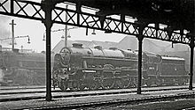 View inside the Shed, with Rebuilt 'Royal Scot' 7P 4-6-0 No. 46153 'The Royal Dragoon' waiting outside to go to Manchester Central to work an express to London St Pancras Trafford Park Locomotive Shed, featuring a 'Royal Scot' locomotive.jpg