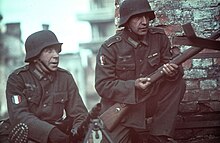 Soldiers of the 638th Infantry Regiment (LVF), then under 7th Infantry Division, on the Eastern Front in 1941 Two soldiers of the Legion of French Volunteers against Bolshevism from the 638th Infantry Regiment in a captured Soviet city 1941.jpg