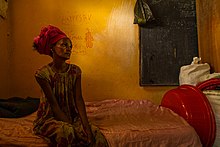 A woman sits on her bed in a classroom-turned-IDP camp in central Mekelle, the capital of the Tigray region, 4 June 2021. VOA Mekele1.jpg