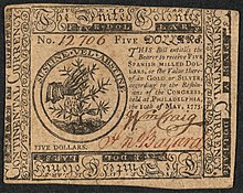 Un billet de cinq dollars émis par le deuxième congrès continental en 1775.