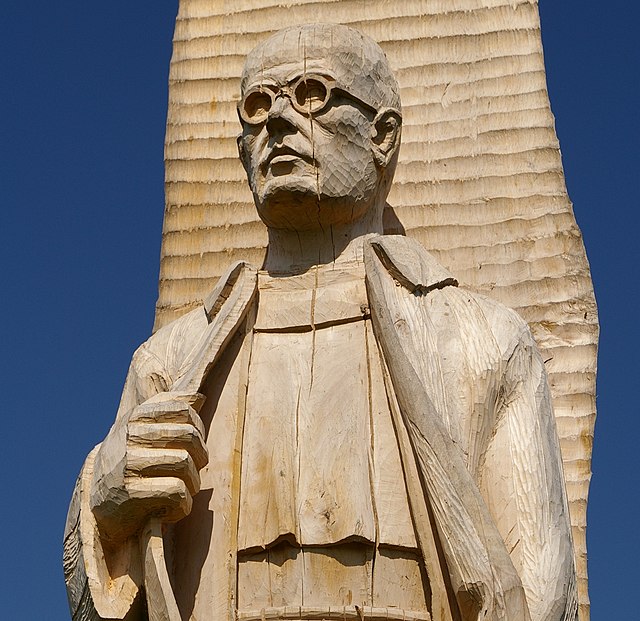 Maximilian Kolbe was imprisoned in 1941 and deported to Auschwitz where he entered the hunger block instead of a fellow prisoner (sculpture in Wiślica