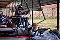 Competitors shoot in an ISSF 50 metre prone competition in Wales. A para-athlete shoots from a chair.