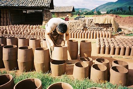 A worker makes ceramics in Yunnan