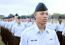 In October 2000, airmen basic stand in formation, awaiting graduation. An airman basic wears no rank insignia. AirmanBasic.jpg