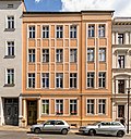 Apartment building in closed development, with right courtyard wing