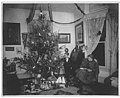 Children posed around a Christmas tree, probably the Warner family, Seattle, 1909 (WARNER 347).jpeg