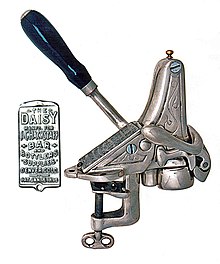 Daisy corkscrew with plate advertising J.C. Hackstaff Bar & Bottlers Daisy mounted corkscrew.jpg