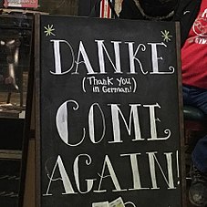 Danke Sign: This sign shows the business's affiliation to Germany. While trying to teach their English-speaking patrons a German word, it does not provide any pronunciation guides or context. Danke Sign.jpg