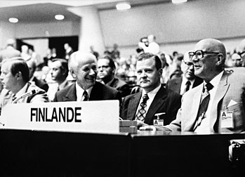 The Finnish delegation to the OSCE at the 1975 CSCE summit in Helsinki included both prime minister Kalevi Sorsa on the left and president Urho Kekkonen on the right. Sorsa came from the SDP which was the largest party for most of the post-war era but through the presidency the Center Party nevertheless held a dominant role. ETYK-Finland-delegation-1975.jpg