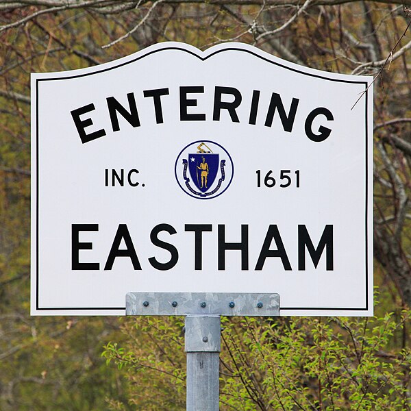 Massachusetts town line sign, indicating the name of the town, the date of its establishment, and the seal of the Commonwealth of Massachusetts.