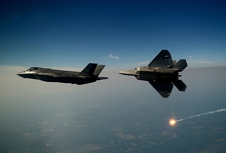 An F-35A Lightning II joint strike fighter from the 33rd Fighter Wing at Eglin Air Force Base, Fla., and an F-22A Raptor from the 43rd Fighter Squadron at Tyndall Air Force Base, Fla., soars over the Emerald Coast Sept. 19, 2012. This was the first time the two fifth-generation fighters have flown together for the Air Force.