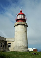 The massive cylindrical tower of the Farol de Ponta do Albarnaz on the northern coast of Flores Farol de Albernaz.jpg