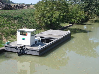 Today canal maintenance is done by barges of Waterways of France. France Canal du Midi peniche VNF.jpg