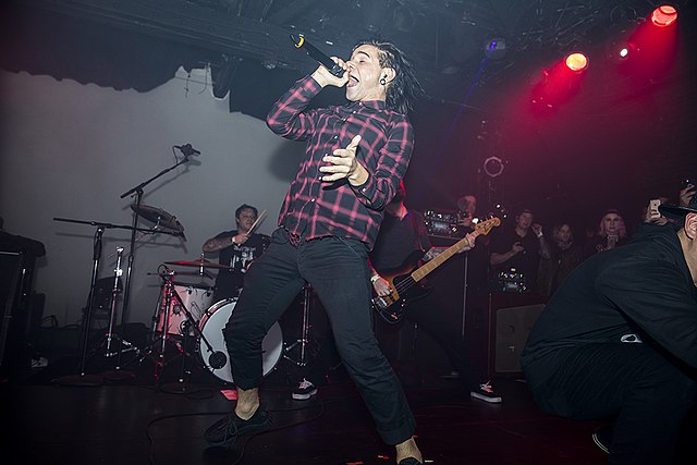 Skrillex performing with From First to Last at Emo Nite in 2017, his first show with the band in over ten years