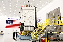 GPS III SV-01 sits in Lockheed Martin's GPS III Processing facility after its successful core mate. SMC's eighth next-generation GPS III satellite completed core mating on April 15 and was named after NASA trailblazer Katherine Johnson. GPS III.jpg