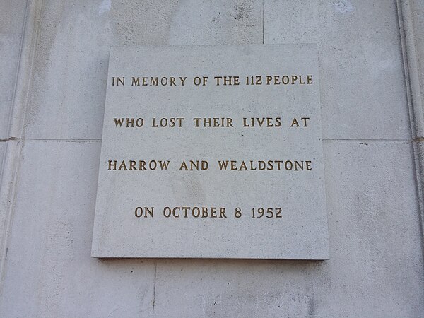 The disaster memorial stone plaque on display at the north entrance of Harrow and Wealdstone railway station