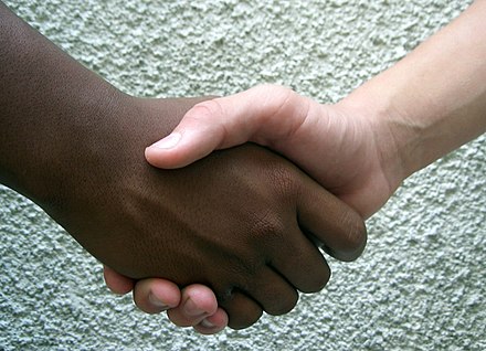 Shaking hands is one form of non-verbal communication.
