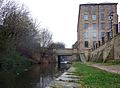 Huddersfield Narrow Canal. View eastward under the Commercial Street bridge to Lock 1E