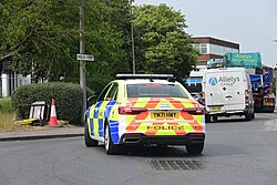 A South Yorkshire Police Audi A6 takes up the rear and orders motorists not to overtake an abnormal load in Kingston upon Hull.