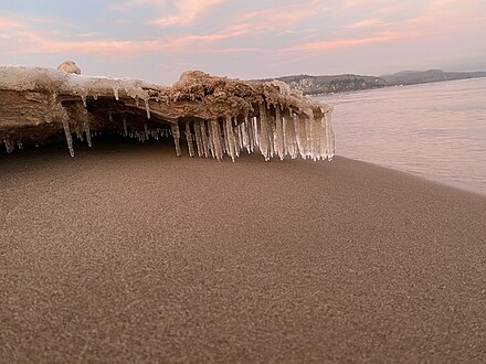 Ice stalactites on a frozen beach in Bete Grise, Michigan