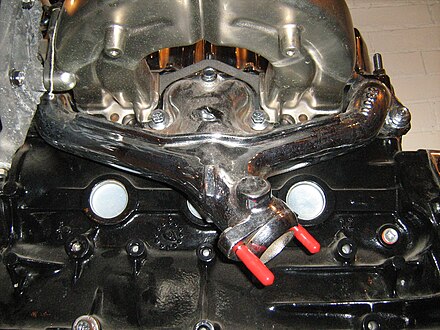 Exhaust manifold (chrome plated) on a car engine
