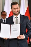 Kamil Bortniczuk odbiera zaświadczenie oder wyborze na posła IX kadencji.JPG