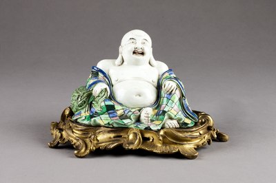 Chinese porcelain figure of Budai with European ormolu stand. Qing dynasty, 1720–1730.
