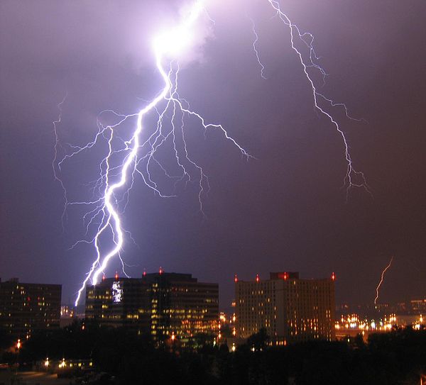 Lightning is a highly visible form of energy transfer and is an example of plasma present at Earth's surface. Typically, lightning discharges 30,000 a