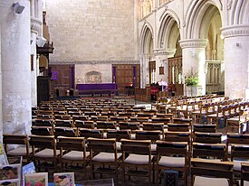 The Abbey interior; the ruined area lies beyond the blank wall rising above the altar