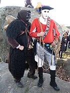 A Mamuthone and an Issohadore, traditional carnival garments from Mamoiada