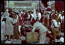 Maxwell Street blues performers and onlookers circa 1950 Maxwell Street Camp Meeting.jpg