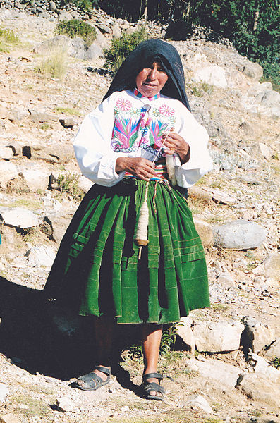 File:Old female with drop spindle on Taquile island Peru.jpg