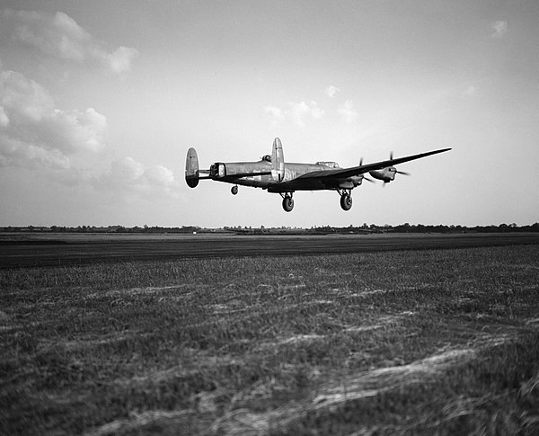 Avro Lancaster B.3, ED831 'WS-H', of No. 9 Squadron taking off from RAF Bardney, Lincolnshire, for a raid on the Zeppelin works at Friedrichshafen in 