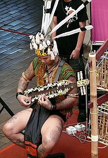 A sape player performing at the Central Market, Kuala Lumpur. Sapeh player, Central Market, Kuala Lumpur, Malaysia - 20070401.jpg