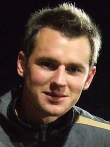 Shane Smeltz, wearing a tracksuit top, looking at the camera