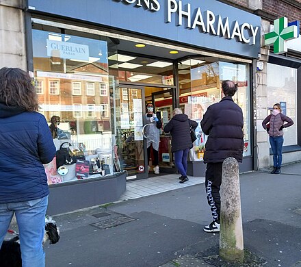 Social distancing at a London pharmacy, 23 March 2020