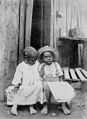 StateLibQld 1 127931 Two young South Sea Islander children sitting on a doorstep, 1902-1905.jpg