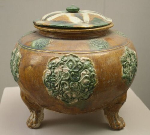 Tang footed jar with relief decoration