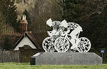 Sculpture of two racing cyclists at the Pixham End roundabout, where the Surrey Cycleway and National Cycle Route 22 meet.