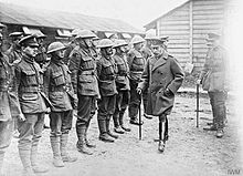 King George V inspecting the remnants of the 2/6th Battalion, North Staffordshire Regiment; Gauchin, 30 March 1918. The German Spring Offensive, March-july 1918 Q297.jpg