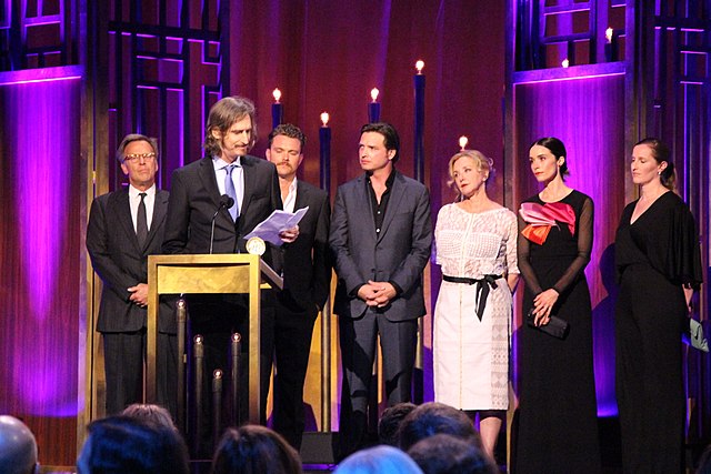 Ray McKinnon, along with Mark Johnson, Clayne Crawford, Aden Young, J. Smith-Cameron, Abigail Spencer and Melissa Bernstein, accept the Peabody Award 